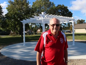Jack Struck, with the Kinsmen Club of Sarnia, stands next to a pergola built recently at Baxter Park in Sarnia. The park was, for many years, the site of the Kinsmen Centre.