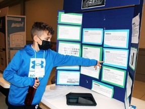 Nash Kondrat, a Grade 4 Errol Village elementary school student, explains his project Acid Rain during the Lambton County Science Fair at the Dante Club on Sunday, April 10, 2022 in Sarnia, Ont.  Terry Bridge/Sarnia Observer/Postmedia Network