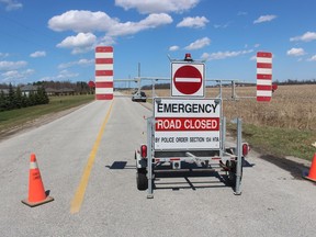 A police road block is shown Thursday on a section of Marthaville Road near Petrolia police closed for a death investigation that is being treated as a homicide.