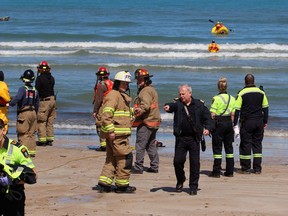 Lawrence Swift, Lambton Shores fire chief, points during a rescue of two men whose canoe capsized on Wednesday, April 20, 2022 in Ipperwash Beach, Ont. Terry Bridge/Sarnia Observer/Postmedia Network