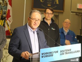 Ross Tius, business manager of UA Local 663 in Sarnia, speaks during Friday's announcement at the union hall of provincial funding for training of apprentices and journeypersons in the union across Ontario. Looking on, centre, is Monte McNaughton, minister of labour, training and skills development, and Bob Bailey, right, MPP for Sarnia-Lambton.