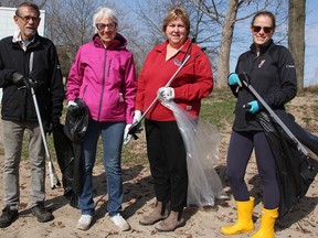 Ron Taylor (left), Betty Taylor, Diane Wigchert and Evelyn Taylor were among about 125 people helping clean Canatara Park Saturday in the City of Sarnia's Community Parks Clean-Up Day. (Tyler Kula/ The Observer)