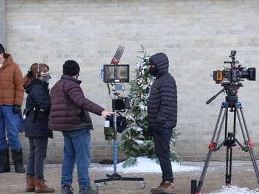 Crew and cast members of Catering Christmas, shoot a scene for the TV movie on Elgin Street in Sudbury, Ont. on Monday April 4, 2022. John Lappa/Sudbury Star/Postmedia Network