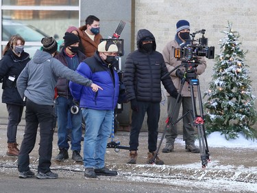 Crew and cast members of Catering Christmas, shoot a scene for the TV movie on Elgin Street in Sudbury, Ont. on Monday April 4, 2022. John Lappa/Sudbury Star/Postmedia Network