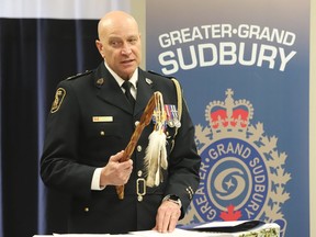 Greater Sudbury Police Chief Paul Pedersen participates in an Aboriginal Welcoming Ceremony for George Couchie (Shkaabewis) in Sudbury, Ontario. on Thursday, April 7, 2022. The special ceremony was held to welcome Couchie to the Greater Sudbury Police Spiritual Team. John Lappa/Sudbury Star/Postmedia Network