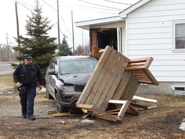Greater Sudbury Fire Services, Greater Sudbury Police and paramedics attended a crash on Falconbridge Highway after a vehicle hit a house in Garson, Ont. on Friday April 8, 2022. There were no serious injuries reported. John Lappa/Sudbury Star/Postmedia Network