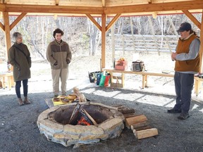 Monique Beaudoin, left, of the Tricultural Committee, Andrew Kesik, of the Canadian Federation of Students, and student Simon Leslie stand near a sacred fire at the University of Sudbury in Sudbury, Ont. on Monday April 11, 2022. The Tricultural Committee for University Education at Sudbury, Not-LU Jazz Combo and the Canadian Federation of Students-Ontario marked the "one-year anniversary of the termination of almost 200 Laurentian University faculty and staff and the closure of 72 programs as a result of Laurentian University's CCAA insolvency proceedings, which were launched in February 2021, " said a release issued on behalf of the organizations. John Lappa/Sudbury Star/Postmedia Network