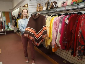 Kalea Loewen, of BusinessKasual, displays some of the fashions available at the local business on Durham Street in downtown Sudbury, Ont. on Tuesday April 12, 2022. BusinessKasual and Sarah White's Kulta Vintage, are located in the same store where El Mercado was located. Both businesses feature vintage clothing and accessories. John Lappa/Sudbury Star/Postmedia Network