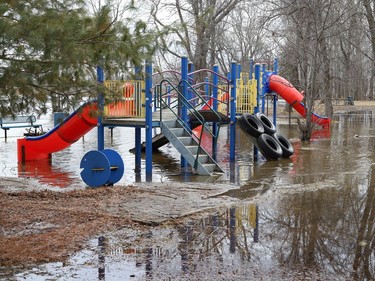 The playground area at Centennial Park in Whitefish, Ont. is partially submerged because of flowing water from Vermilion River on Monday April 18, 2022. Conservation Sudbury and the Ministry of Northern Development, Mines, Natural Resources and Forestry have cautioned people in the area to be careful of possible flooding. John Lappa/Sudbury Star/Postmedia Network