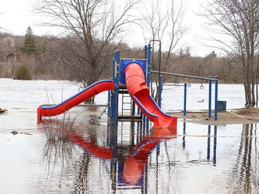 The playground area at Centennial Park in Whitefish, Ont. is partially submerged because of flowing water from Vermilion River on Monday April 18, 2022. John Lappa/Sudbury Star/Postmedia Network