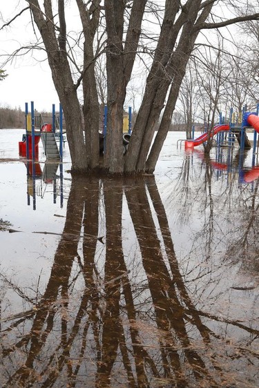 The playground area at Centennial Park in Whitefish, Ont. is partially submerged because of flowing water from Vermilion River on Monday April 18, 2022. John Lappa/Sudbury Star/Postmedia Network