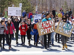 Students from R.L. Beattie Public School and members of Friday's For Future take part in an Earth Day Climate March as part of year two events for the United Nations Decade of Restoration at Laurentian University in Sudbury, Ont. on Friday April 22, 2022. John Lappa/Sudbury Star/Postmedia Network