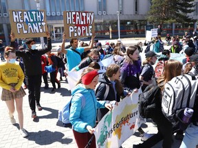 Students from R.L. Beattie Public School and members of Friday's For Future take part in an Earth Day Climate March as part of year two events for the United Nations Decade of Restoration at Laurentian University in Sudbury, Ont. on Friday April 22, 2022. John Lappa/Sudbury Star/Postmedia Network