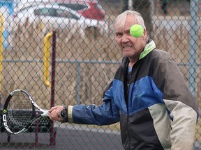 Seventy-five-year-old Carl Rauhala returns a ball during a game of tennis at the courts at James Jerome Sports Complex in Sudbury, Ont. on Monday April 25, 2022. John Lappa/Sudbury Star/Postmedia Network