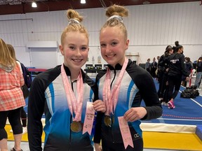 Bluewater Gymnastics Club members Ana Podolinsky (left) and Abby Duffy (right) show off medals from a recent competition in Niagara Falls. Handout/Sarnia This Week