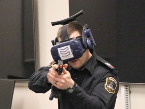 Timmins Police Service Sgt. Jonathan Minard engages with an armed suspect in a virtual reality training scenario at Northern College on Tuesday afternoon.

ANDREW AUTIO/The Daily Press