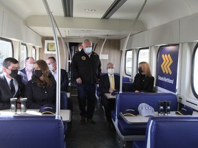 Ontario Premier Doug Ford, centre, enters a passenger rail car headed from Hoyle to Porcupine for a press conference held earlier this month where he announced the government's $75-million commitment to reinstate passenger rail service in Northeastern Ontario.

RON GRECH/The Daily Press