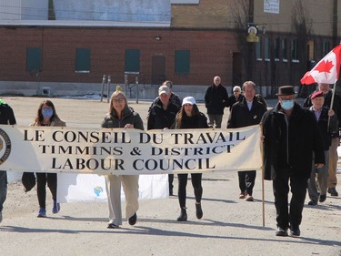 The initial group of marchers are seen headed towards the Miners Memorial in Schumacher where the National Day of Mourning ceremony was held Thursday. A total of about 40 people attended the gathering to remember and honour those lives lost or injured due to a workplace tragedy, and to collectively renew their commitment to improve health and safety in the workplace and prevent further injuries, illnesses and deaths.

RON GRECH/The Daily Press