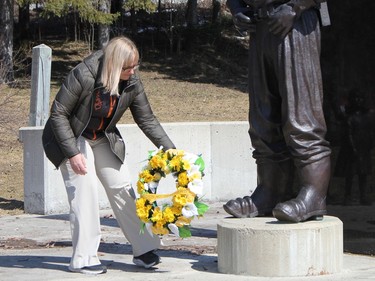 Tamara Tremblay Bartolomucci, with the Northeastern unit of Ontario English Catholic Teachers Association, lays a wreath at the foot of the Miners Memorial following the National Day of Mourning ceremony held in Timmins on Thursday.

RON GRECH/The Daily Press