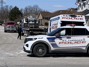 St. Thomas police investigate a crash on March 29, 2022, on Thorman Terrace near Burwell Road in St. Thomas that left a woman who was jogging with serious injuries.  (DEREK RUTTAN, The London Free Press)