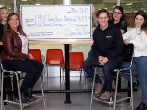 Slash The Stigma adult hockey fundraising tournament organizers Kelsey Van Ymeren and Taylor Schut (front, right) presented a cheque for $29,013 in support of area Canadian Mental Health Association (CMHA) initiatives on March 29 at Norwich's Nor-Del Arena. Thrilled to accept the support, were (left, rear) Sue Forbes, Regional Manager CMHA Thames Valley Addictions and Mental Health Services (TVAMHS), Oxford; (left, front) Fund Development Coordinator, CMHA TVAMHS Stacey Robinson; and right, rear, Miranda Mitchell, Peer Support Coordinator CMHA TVAMHS, Oxford. (Submitted)