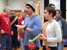 Zoey Papadakos, on the right, walks with her father, George Papadakos, in the 2019 Walk For Alzheimer's at the Tillsonburg Community Centre. Zoey was the top individual fundraiser at the event raising nearly $3,000. This year's Walk for Alzheimer's will be an outdoor event on May 28 at Memorial Park. (CHRIS ABBOTT)