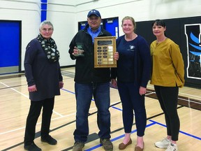 Derek Sager was named the 2022 Ron Pelham Award recipient during a volunteer appreciation event April 26 at the Cultural-Recreational Centre. He's pictured here with, from left, Louise Schmidt, a Palliser School District trustee and Vulcan and District Recreation Committee member, Bonnie Ellis, the Town of Vulcan's community services manager, and Barb Moore Coffey, a Town of Vulcan councillor and the Vulcan and District Recreation Committee chair.