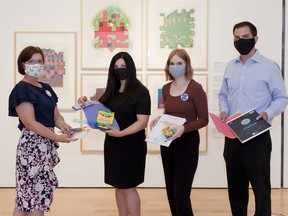 Head of education Stephanie Porter, Children's Aid Society Oxford executive director Tina Diamond, education assistant Deanna Logan and Investment Planning Counsel certified financial planner Eric Hedges (from left) celebrate the launch of the Community Creation Art Kits program at the Woodstock Art Gallery. (Trish Roberts/Custom Concept Photography)