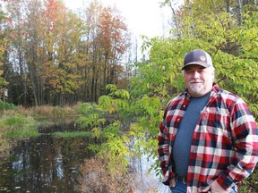 Chris Lee stands by one of the ponds he restored on his property along Old Stage Road. His efforts have earned him a nomination for the  Oxford County Stewardship Award. (Submitted photo)