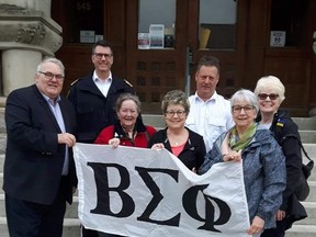 Mayor Joe Preston, fire Chief Kevin Welsh, Valere Gregory, Joan Perry, Deputy fire Chief Dave Gregory, Jean Sunderland and Nancy O'Loane raise the Beta Sigma Flag Phi at St. Thomas city hall. The woman are members of the sorority's two chapters in the city.

Contributed