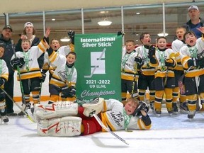 The "small but mighty" West Lorne Comets poses with their Silver Stick Champion banner. In the front row is Spencer Rainey. Second row, from left: Logan Wilson, Nathan Pinder and Sam Ryan. Third row, from left: Ryker Vergeer, Archie Lee, Wes Vergeer, Macen Toth, Alexander Tait and Lucas Weed. Back row: head coach Rob Tait, assistant coach Karter Rowsom, assistant coach and trainer Terry Weed. West Lorne Minor Hockey photo