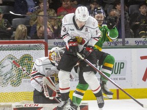 Camaryn Baber of the Knights is checked by Gavin Bryant of Owen Sound as Baber tries to screen Nick Chenard in net for the Attack during the first period of their Friday night game at Budweiser Gardens.

Photograph taken on Friday April 8, 2022. 

Mike Hensen/The London Free Press/Postmedia Network