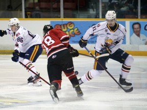 Artur Cholach, the lone Ukrainian player in the Ontario Hockey League, blocks Servac Petrovsky's shot in the first period as the Owen Sound Attack host the Barrie Colts for the final time this season inside the Harry Lumley Bayshore Community Centre on Wednesday, April 13, 2022. Greg Cowan/The Sun Times