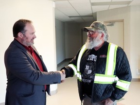 Reeve John Burrows congratulated landowner Keith Knafelc on a rezoning that will accommodate his business in Blue Ridge.