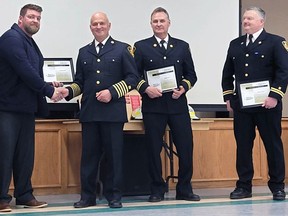 Millet Fire Chief Steve Moen, Capt. Derek Day and Capt. Brett Jevne were presented with 20-year service awards by Millet Town Coun. Mat Starky.Vicki Pyle