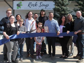 Wetaskiwin Mayor Tyler Gandam (centre right) and members of Wetaskiwin County and the Leduc, Nisku and Wetaskiwin Chamber of Commerce joined Rock Soup Green House and Food Bank founder Craig Haavaldsen and other Rock soup staff and volunteers to cut the ribbon marking the organization's first anniversary Saturday.
Christina Max