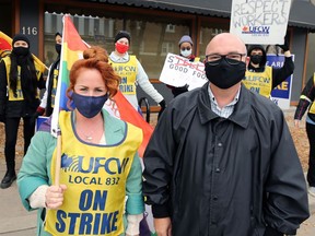 UFCW Local 832 president Jeff Traeger (right, on a picket line in 2020) said it’s “absolutely disgusting” that Manitoba's minimum wage will only increase by 40 cents in October.