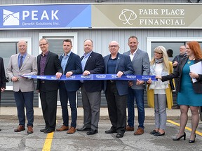 Local leaders gather alongside members from Howell Financial Corp and Park Place Financial and Peak Benefit Solutions group of companies to celebrate the joining of the companies. Submitted
