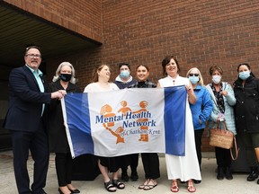 The Mental Health Network of Chatham-Kent and the Municipality of Chatham-Kent recognized Mental Health Week with a flag-raising event at the Chatham-Kent Civic Centre on May 4, 2022. Shown here are Mayor Darrin Canniff, Coun. Karen Kirkwood-Whyte, Jenny Jackson with the network, Coun. Amy Finn, Natalie Gottshling with the network, network executive director Kelly Gottshling, Coun. Marjorie Crew, Becky Elgie with Canadian Mental Health Association Lambton-Kent and Rebecca Smyth with CMHA. (Tom Morrison/Postmedia Network)