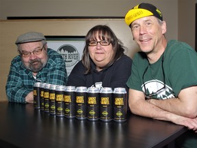 South River Brewing Co. Co-owners Dwayne Wanner and Bernie Liehs flank general manager Jacquie Lockhart as the trio display the beer made specifically for the Ghost Gravel ride.
Rocco Frangione Photo