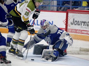 Sudbury Wolves goaltender Mitchell Weeks makes a save during first-period OHL action against the North Bay Battalion at Sudbury Community Arena in Sudbury, Ontario on Friday, April 15, 2022.