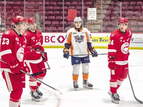Soo Greyhounds forward Cole MacKay shoots a look at teammates Rory Kerins (23) and Robert Calisti with Flint Firebirds forward Samuel Assinewai "caught in the middle" during recent Ontario Hockey League play at GFL Memorial Gardens.  Cole MacKay scored a power-play marker in the second period but it wasn't enough as the Greyhounds dropped a 5-3 decision to the Firebirds on Sunday afternoon.