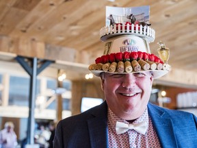 Steve Wells poses in his hat, constructed by his wife, at the United Way HPE Kentucky Derby Fundraiser on Saturday near Belleville, Ontario. ALEX FILIPE