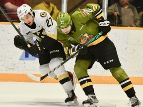 Matvey Petrov of the North Bay Battalion leans into Lucas Edmonds of the visiting Kingston Frontenacs in their Ontario Hockey League second-round playoff game Sunday. The teams meet Tuesday night at Kingston.
Sean Ryan Photo