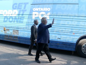Progressive Conservative Leader Doug Ford and Sault Ste. Marie Tory candidate Ross Romano leave Sault College in Sault Ste. Marie, Ont., on Saturday, May 7, 2022. (BRIAN KELLY/THE SAULT STAR/POSTMEDIA NETWORK)