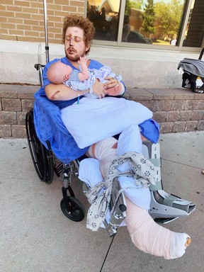 Clayton Ball holds his newborn son Briar a couple of days after the then-24-year-old Sarnia resident was injured in a hit-and-run crash on Aug.  21, 2020. (GoFundMe)