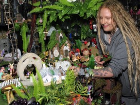 Braelyn Rose arranges the fairy village, one of many exhibits she created and which is on display at the Crystal Retail Shoppe.
Rocco Frangione Photo