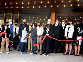 Flanked by fellow actors, local politicians, Stratford Festival executives and board members, and others, Dominic Moody, Ezra Wreford, Chase Oudshoorn and Bram Watson – all child actors in the Stratford Festival’s production of Richard III, which debuted to the public as the first production staged at the new Tom Patterson Theatre Tuesday afternoon – cut the ribbon at a grand-opening ceremony attended by hundreds of people for the festival’s $72-million Tom Patterson Theatre Tuesday morning. Galen Simmons/The Beacon Herald