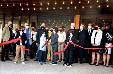 Flanked by fellow actors, local politicians, Stratford Festival executives and board members, and others, Dominic Moody, Ezra Wreford, Chase Oudshoorn and Bram Watson – all child actors in the Stratford Festival’s production of Richard III, which debuted to the public as the first production staged at the new Tom Patterson Theatre Tuesday afternoon – cut the ribbon at a grand-opening ceremony attended by hundreds of people for the festival’s $72-million Tom Patterson Theatre Tuesday morning. Galen Simmons/The Beacon Herald