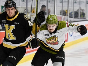 A determined Kyle Jackson drives past Jake Murray of the Kingston Frontenacs in Ontario Hockey League playoff action Tuesday night. Jackson scored four goals in the visiting North Bay Battalion's 6-3 win in the Eastern Conference semifinal series.
Sean Ryan Photo